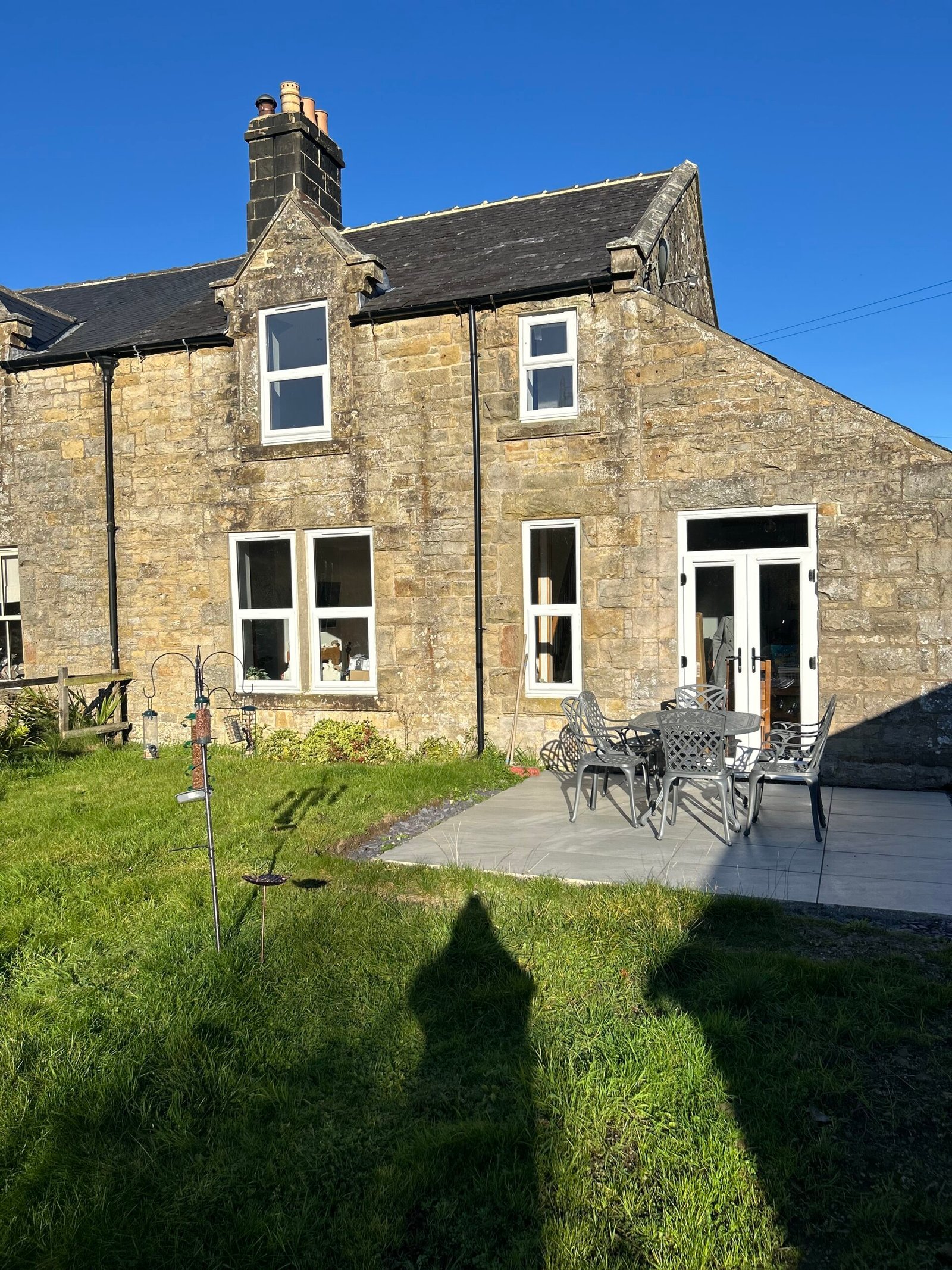 Kielder Station Master's House from the garden, with patio and outdoor seating